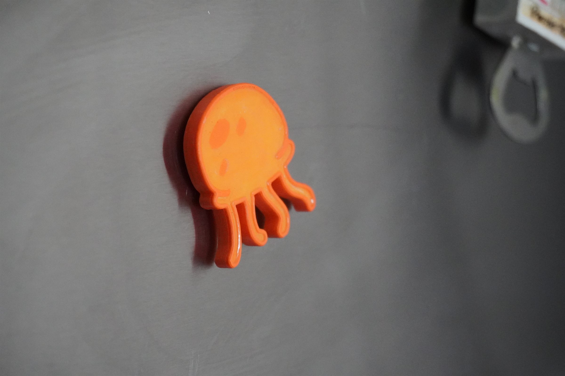 Haunted Jellyfish Relic magnet on a metal surface